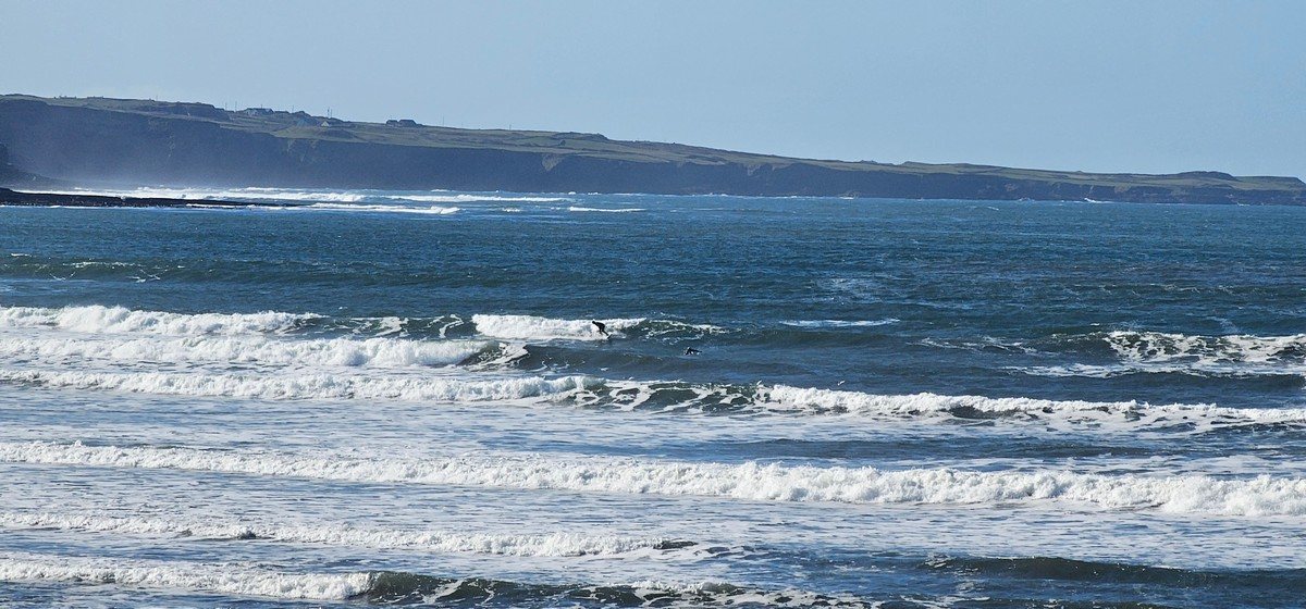 Surfer on a wave at cornish point